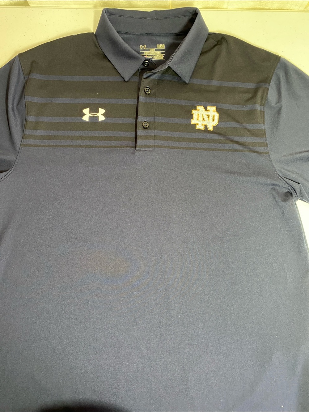 Under Armour Navy and Black Notre Dame Performance Polo with Gold Logo